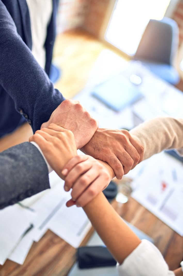 Team joining hands